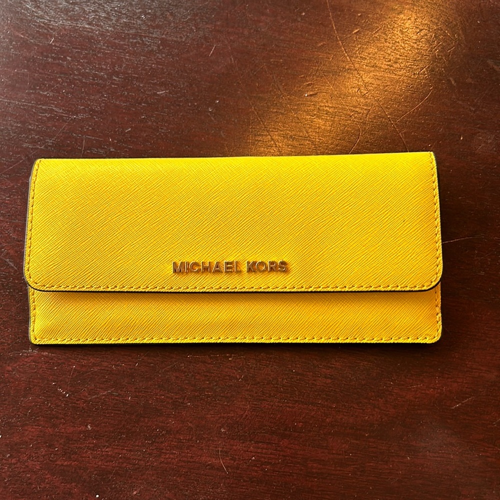 Michael Kors wallet with 4 card slots and 2 flat bill holders